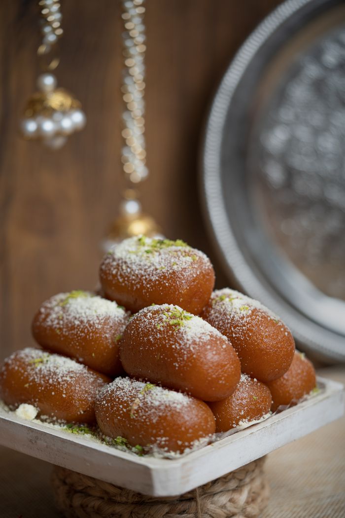 A display of traditional Indian sweets garnished, perfect for festive occasions.