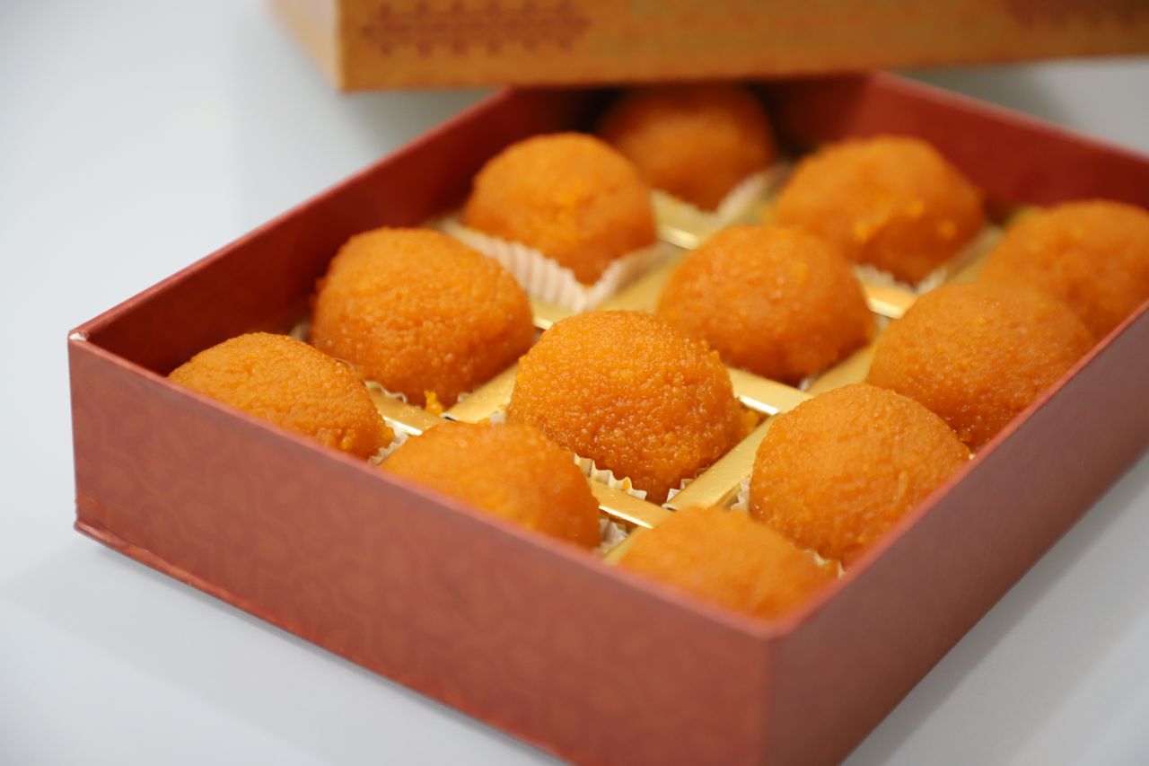 A box of delicious traditional Indian laddoo sweets, perfect for festive celebrations.