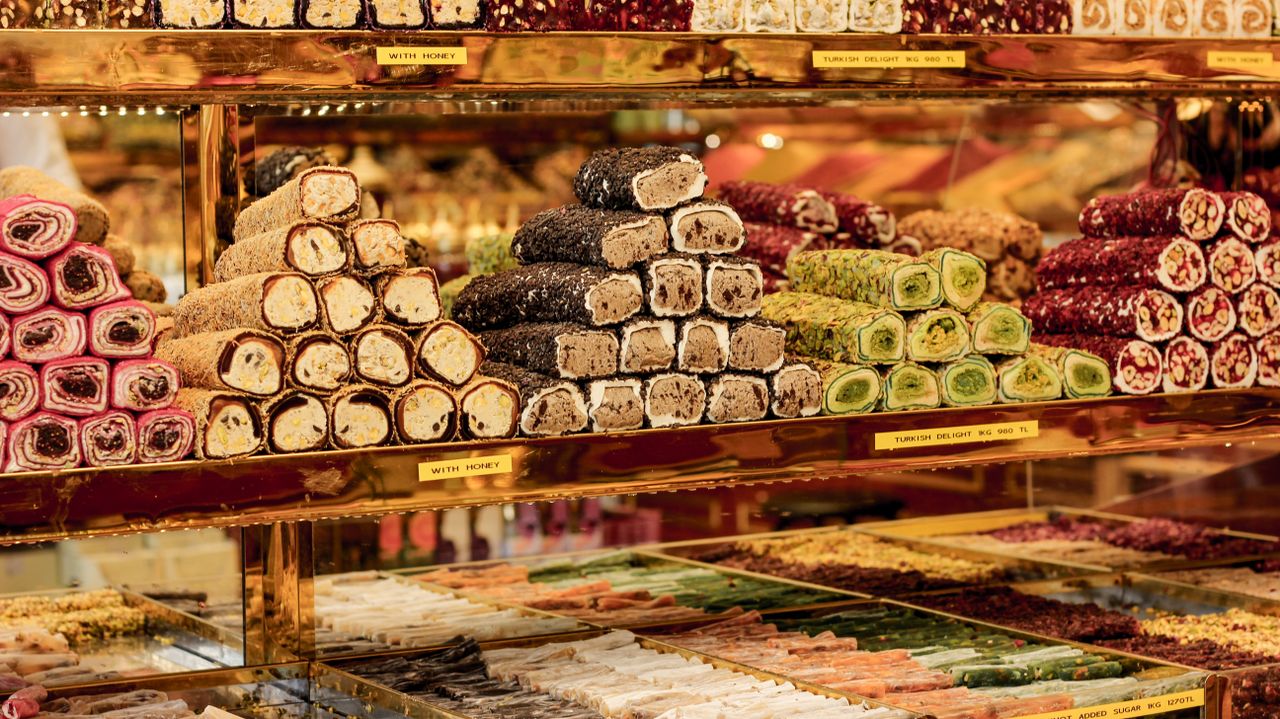Assorted Turkish delight in vibrant colors on display in a shop.